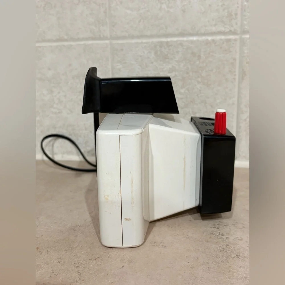 Vintage Polaroid Swinger camera and case
